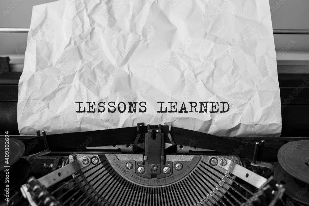 Poster text lessons learned typed on retro typewriter