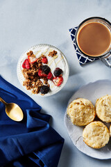 Yogurt Bowl and Biscuits with Coffee on Marble Table