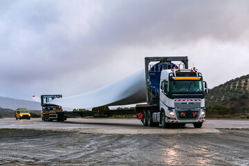 Fototapeta na wymiar Special transport truck transporting a wind turbine blade.