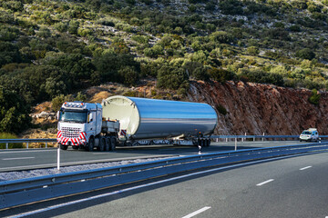 Special transport, truck transporting part of the base of a wind turbine.
