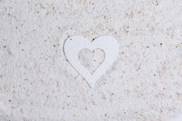 Marine photophone made of white sand and heart. Travel and love theme. Horizontal photo with place for text, banner.