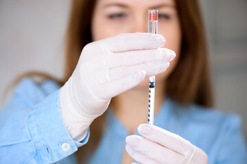 Coronavirus vaccine. A doctor makes a coronavirus vaccine at a hospital.