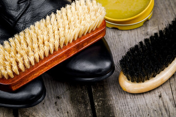 Accessories for the care and cleaning of shoes on a wooden table