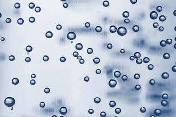 Sparkling water in glass. Classic blue tone