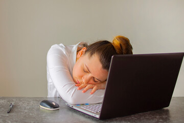 Office worker sleeping on laptop