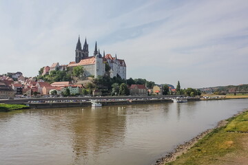 Naklejka premium View over the Elbe river at Meissen, the castle and the towers of the cathedral. Meissner Dom and Albrechtsburg above the Elba river, Saxony, Germany