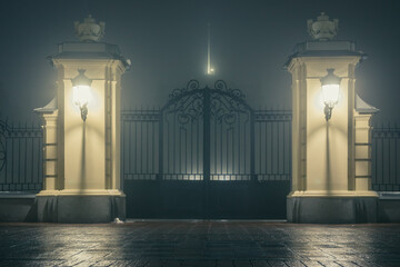 The main gate and fence of the Mariinsky Palace on a foggy winter night. Mariinsky Palace is the official ceremonial residence of the President of Ukraine in Kyiv. Ukraine