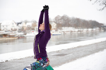 Young woman doing sport in winter outdoors in sportswear. Happy woman doing sport. 