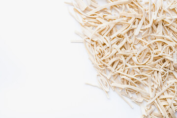 homemade noodles on white background 