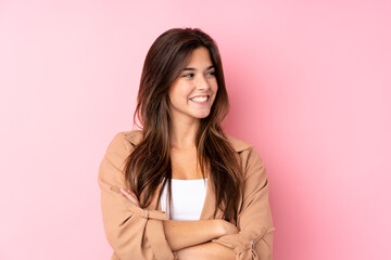 Fototapeta premium Teenager Brazilian girl over isolated pink background laughing