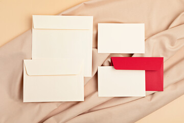 Mockup of blank cards and envelopes over neutral beige background