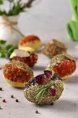 Eco-design of Easter eggs with various spices and cereals, without dyes and preservatives on a gray concrete background, Vertical format, Closeup