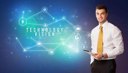 Businessman in front of cloud service icons with TECHNOLOGY VISION inscription, modern technology concept