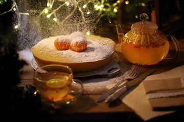 Powdered sugar is poured onto the cake