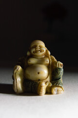 Fat Buddha with empty background.