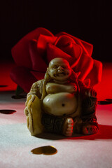 Fat Buddha with a red back light.
