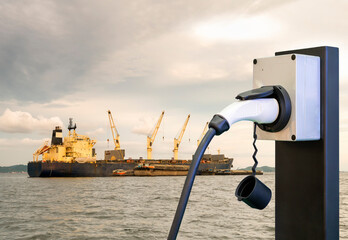 Electric station charger with plug and power cable supply and Large cargo ship for logistic import...