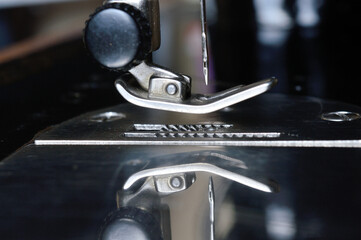 old sewing machine, close-up of needle plate and presser foot
