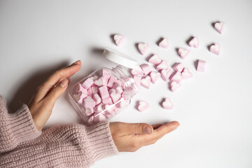 Marshmallows in the shape of a heart on background. Valentines day concept 