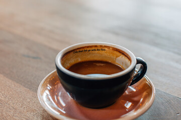 cup of coffee on wooden table
