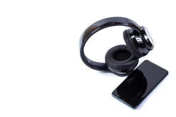 Cellphone and headphones isolated on a white.