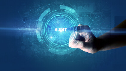 Hand touching AUDIT button, modern business technology concept