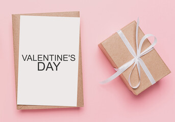 Gifts with note letter on isolated pink background, love and valentine concept with text Valentines Day