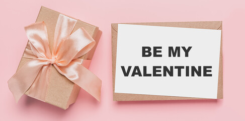 Gifts with note letter on isolated pink background, love and valentine concept with text be my Valentine