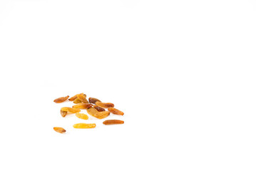 Elongated raisins on a white background. Natural sweets