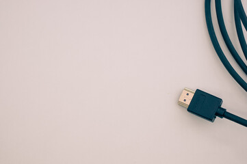 High angle closeup shot of a cable on a beige surface