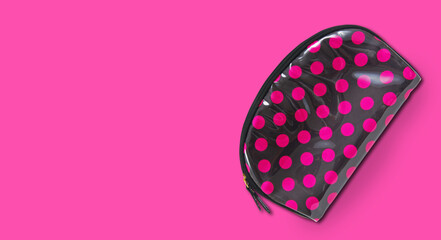 Fashion cosmetics bag on the pink