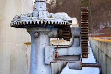 Large gears in an old gearbox. Steel structure to transfer rotational energy.