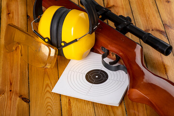 Pneumatic weapons and shooting accessories. Shield hearing protectors on the shooting range.