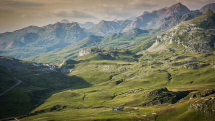 Fototapeta premium Farm in the mountains during sunset