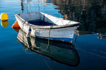 Old fishing boat anchored in the harbor