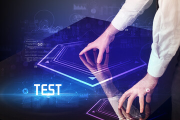 Hand touching digital table with TEST inscription, new age security concept