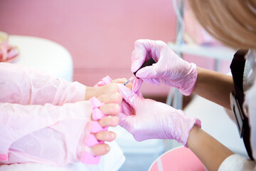 Obraz na płótnie Canvas Specialist with client in beauty salon. Professional beauty service. Pedicure, manicure concept.
