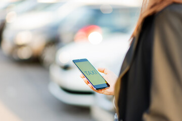 Call a taxi using the mobile app on your smartphone.