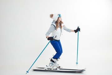 young woman goes skiing. Skier maneuvers on mountain skis, photos on a white background in the...
