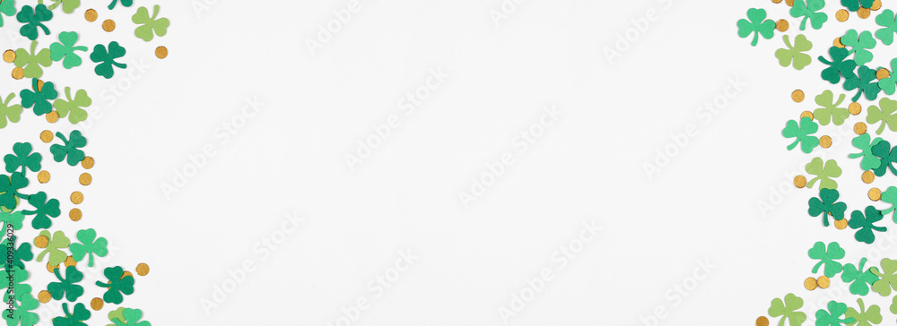 Poster St Patricks Day shamrock and gold coin confetti double border. Top view banner with a white background and copy space.