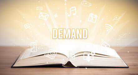 Opeen book with DEMAND inscription, business concept