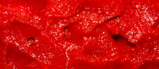 The texture of tomato paste.Ketchup background.Tomato sauce.