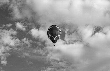 Hot air balloon in the cloudy sky