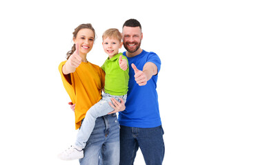 Fototapeta premium Positive family showing thumbs up at camera in studio