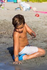 children playing in the sand on the beach