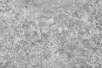 Light gray granite texture of an old stone wall with cracks and scratches grunge background
