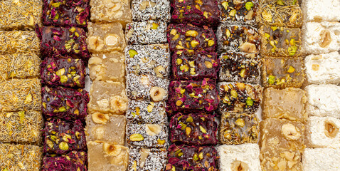 Colorful Turkish delight (aka lokum). Middle Eastern dessert popular in the month of Ramadan. Turkish delight with rose, honey, figs, coconut, pistachios.