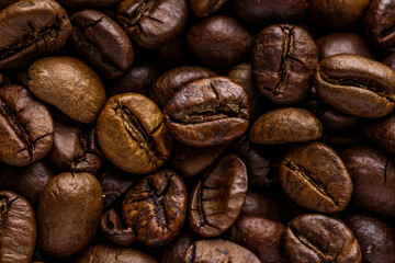 Fresh roasted coffee bean background. Background of roasted coffee beans, top view