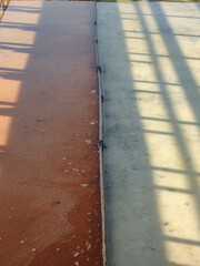 geometric red and white salt flats with shadow and highlights in ria de aveiro, portugal