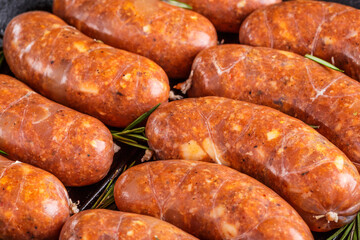 Grilled sausages, homemade,cast iron skillet or frying pan with tomatoes, garlic and rosemary. Brazilian barbecue. copy space